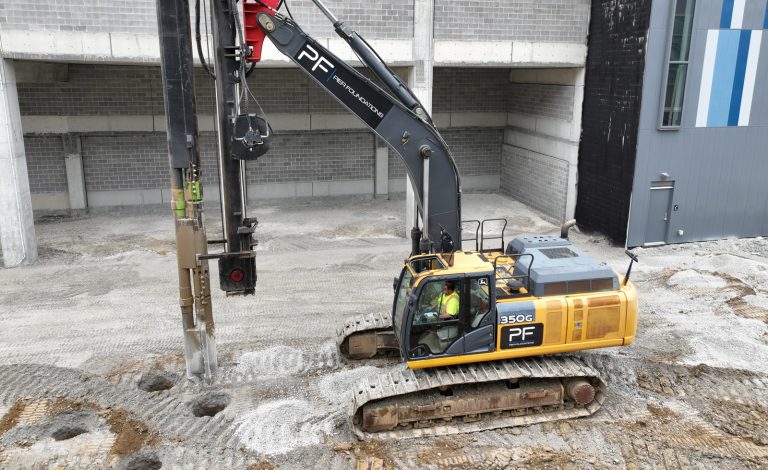 drill rig operating inside building foundation